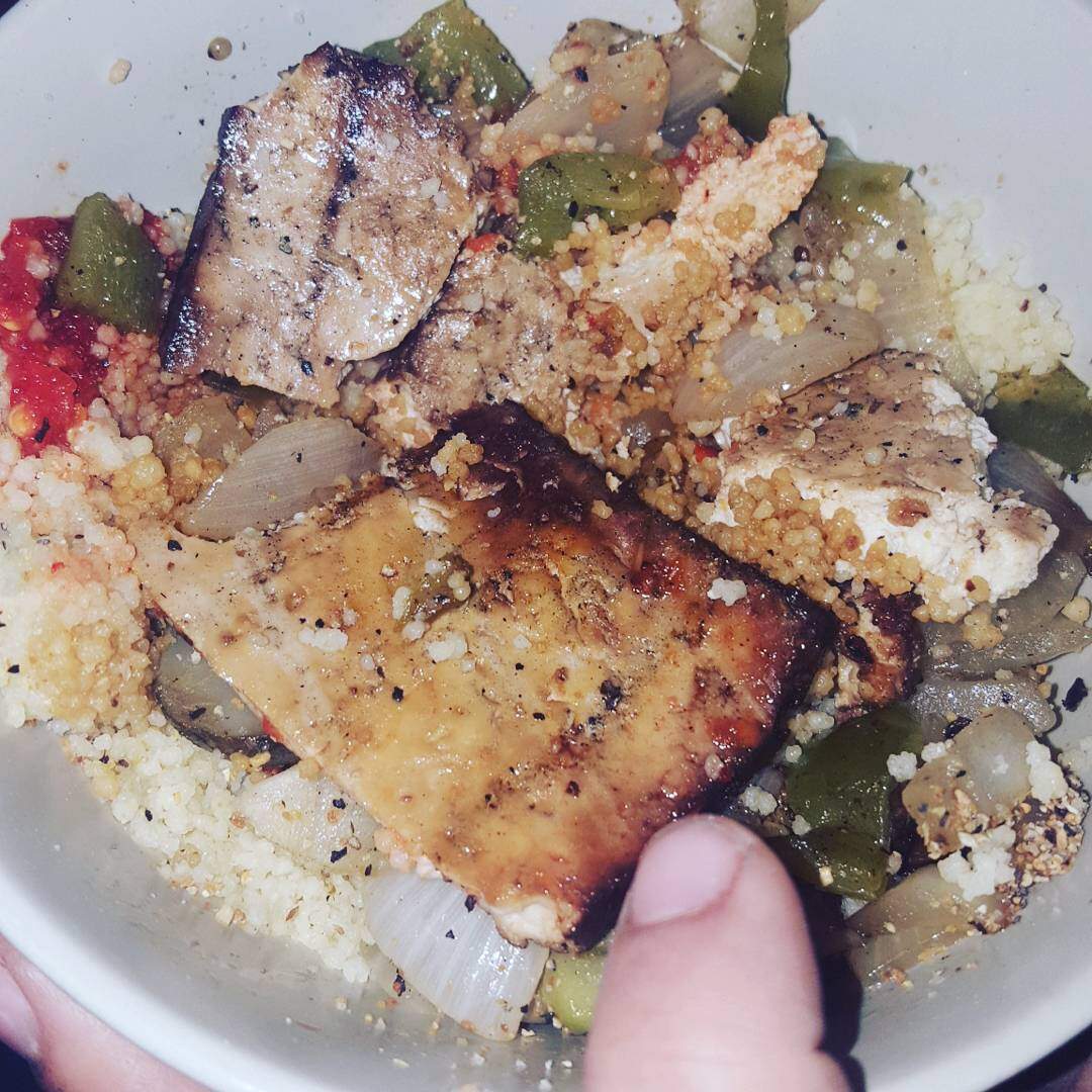 Tofu Steak with grilled green peppers, onions, and sunchokes and couscous
